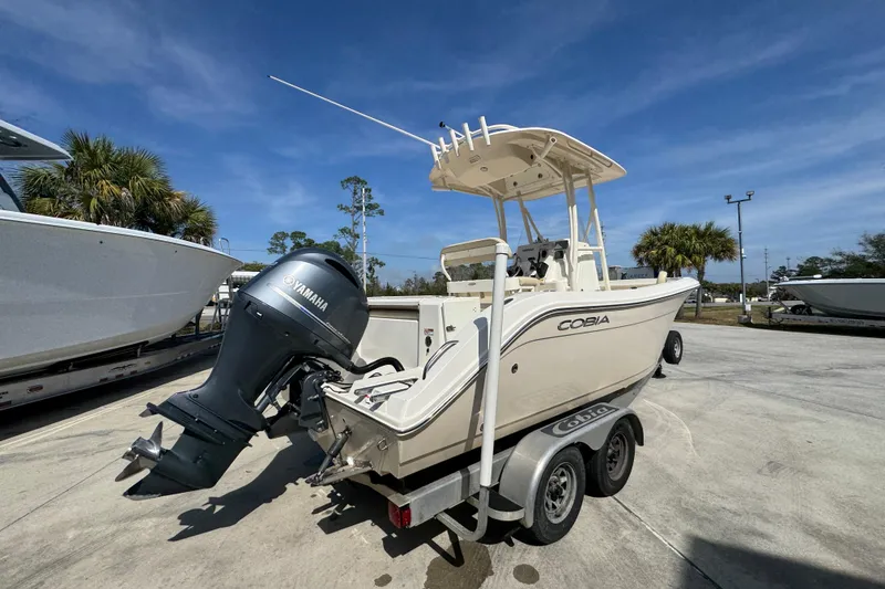 Slide: The Image of 2017 Cobia 220 Center Console boat with Yamaha outboard motor on trailer. - 11