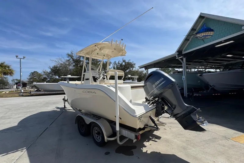 Slide: The Image of 2017 Cobia 220 Center Console boat with Yamaha engine on trailer. - 15