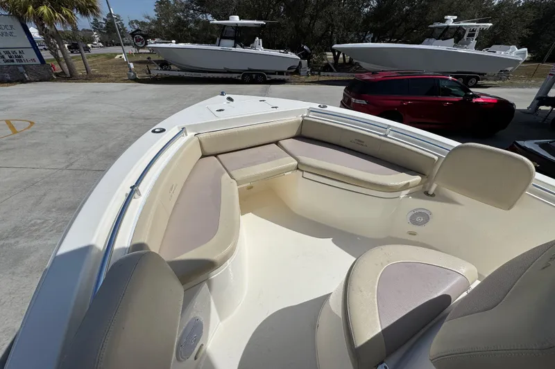 Slide: The Image of 2017 Cobia 220 Center Console boat with spacious seating and sleek design. - 19