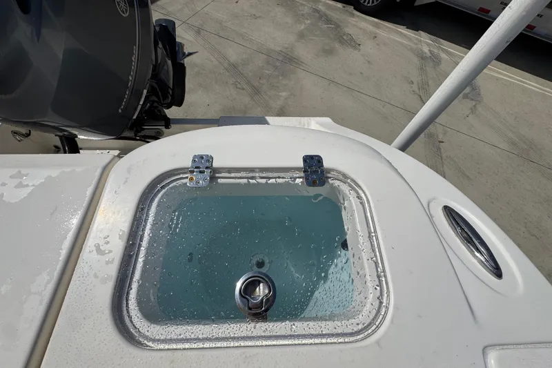 Slide: The Image of 2017 Cobia 220 Center Console livewell with Yamaha outboard motor. - 39