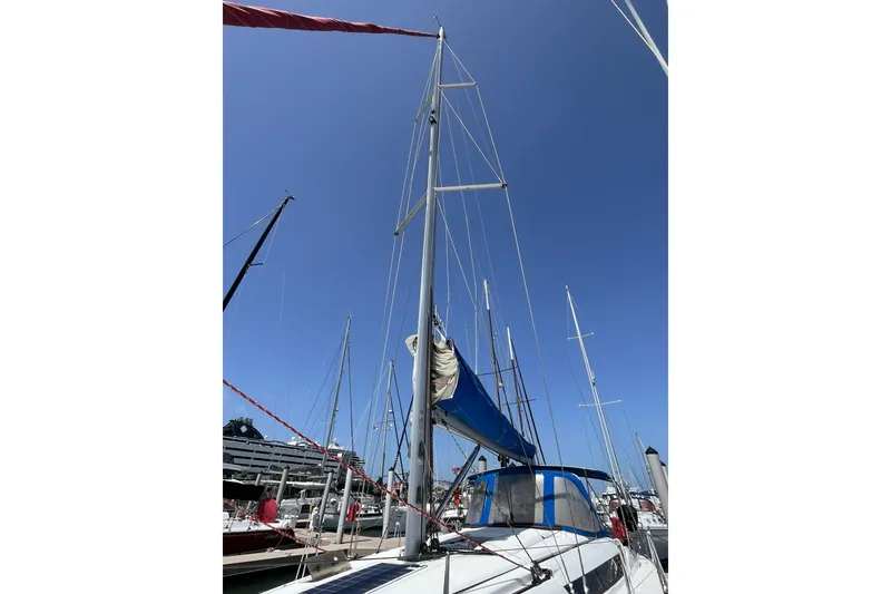 Slide: The Image of 2017 Jeanneau Sun Odyssey 419 sailboat with blue sky background at marina. - 13