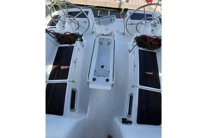 Slide: The Image of Cockpit of 2017 Jeanneau Sun Odyssey 419 sailboat with dual steering wheels. - 16