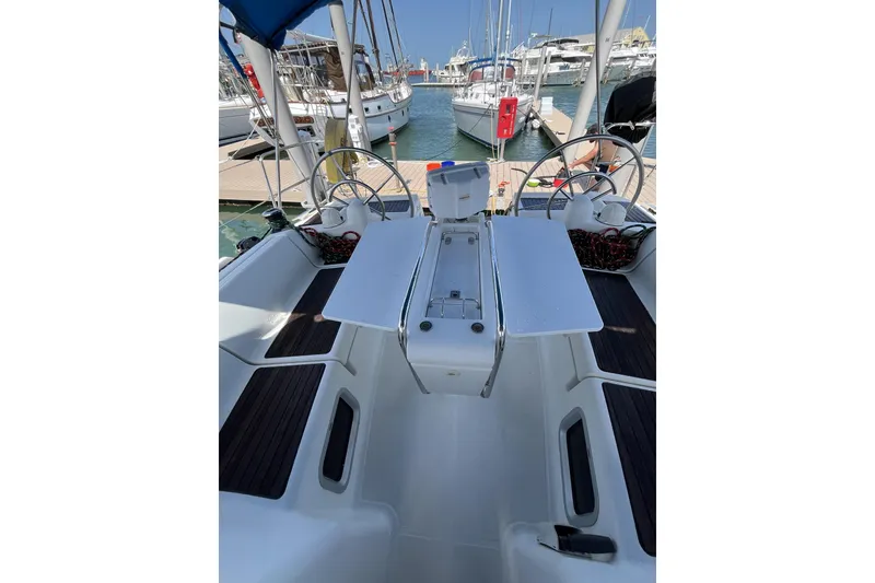 Slide: The Image of 2017 Jeanneau Sun Odyssey 419 cockpit with dual steering wheels at marina. - 19