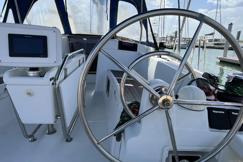 Slide: The Image of 2017 Jeanneau Sun Odyssey 419 cockpit with steering wheel and navigation equipment. - 20