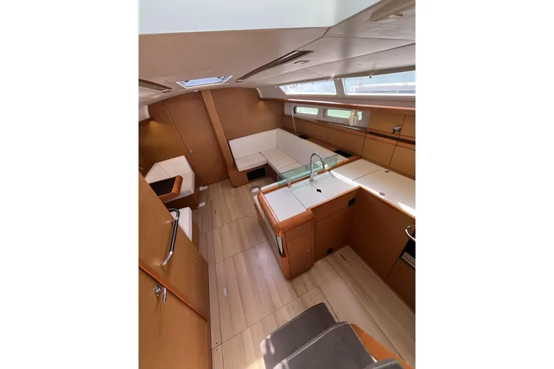Slide: The Image of Interior of 2017 Jeanneau Sun Odyssey 419 sailboat, featuring modern wood finish and spacious layout. - 23