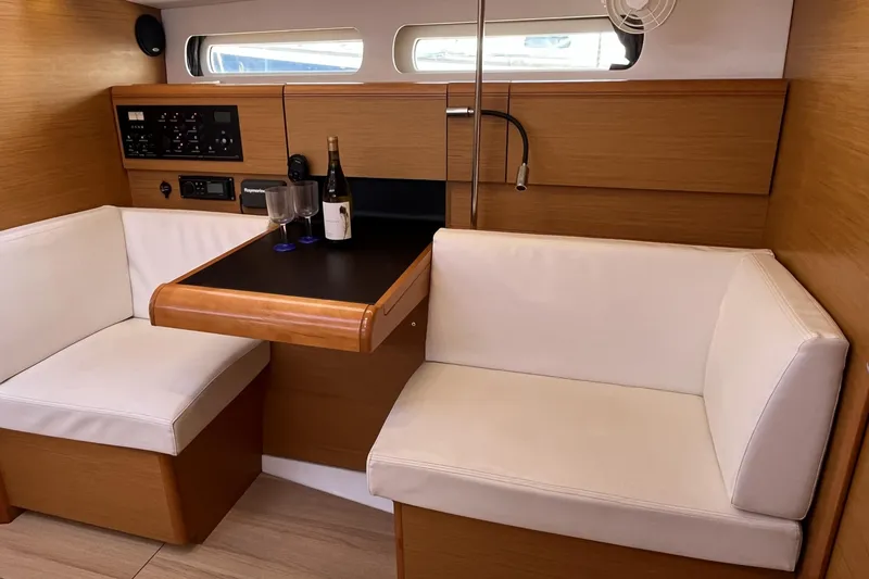 Slide: The Image of Interior of 2017 Jeanneau Sun Odyssey 419 yacht with cozy seating and table. - 25