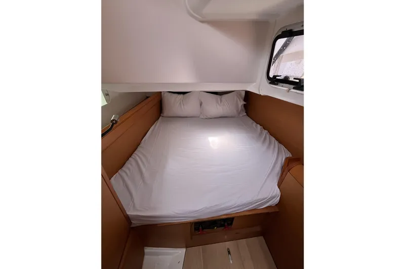 Slide: The Image of Cozy cabin interior of 2017 Jeanneau Sun Odyssey 419 sailboat with bed and window. - 36