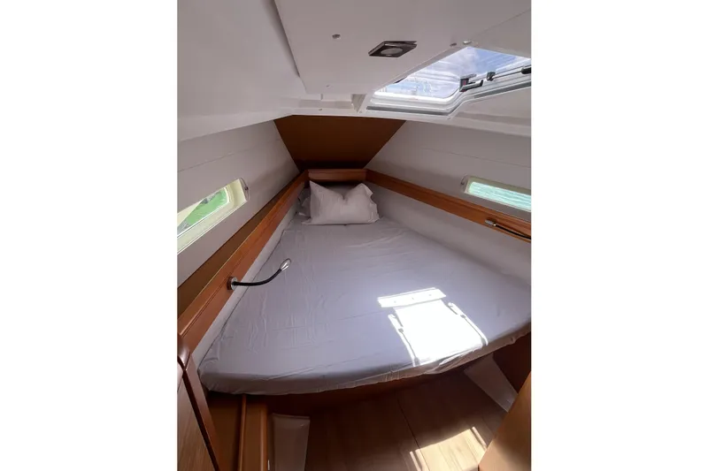 Slide: The Image of Cozy cabin interior of 2017 Jeanneau Sun Odyssey 419 sailboat with skylight and bed. - 38