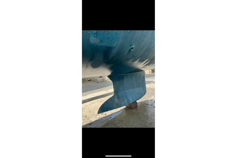 Slide: The Image of 2017 Jeanneau Sun Odyssey 419 keel in dry dock, showing hull details. - 41