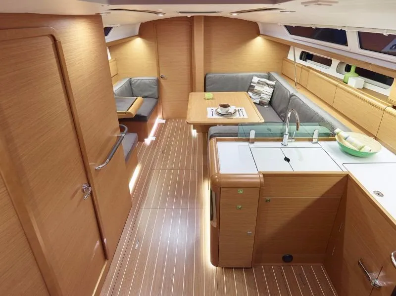 Slide: The Image of Manufacturer Provided Image: Interior of 2017 Jeanneau Sun Odyssey 419 sailboat with modern kitchen and dining area. - 8