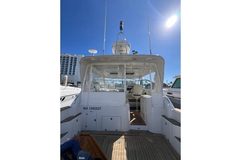 Slide: The Image of Luxurious 2007 Chris-Craft Roamer 40 yacht deck with elegant seating and wooden table. - 12