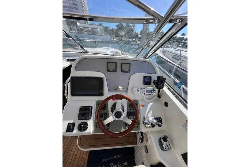 Slide: The Image of Luxurious 2007 Chris-Craft Roamer 40 yacht interior with elegant seating and helm station. - 14