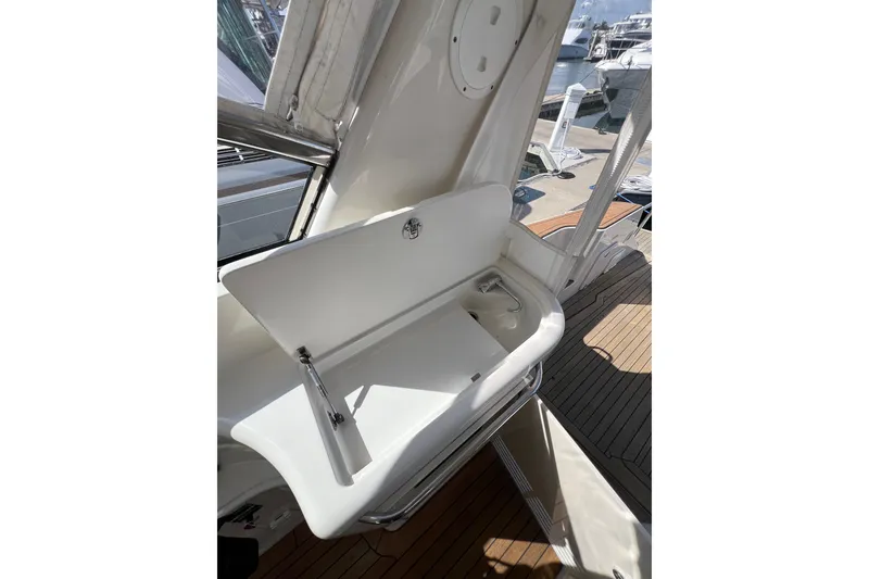 Slide: The Image of 2007 Chris-Craft Roamer 40 helm with navigation controls and wooden steering wheel. - 16