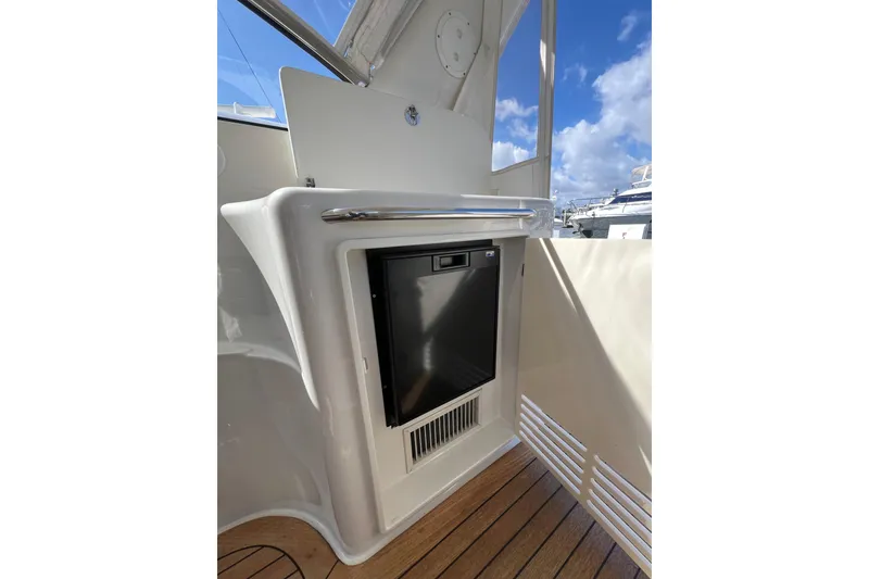 Slide: The Image of 2007 Chris-Craft Roamer 40 yacht sink and deck area, featuring sleek design and wood flooring. - 17