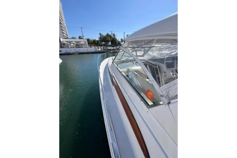 Slide: The Image of Built-in refrigerator on 2007 Chris-Craft Roamer 40 yacht, featuring sleek design and wood flooring. - 18