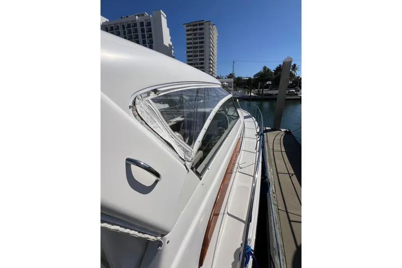 Slide: The Image of Luxurious 2007 Chris-Craft Roamer 40 yacht interior with elegant seating and wooden flooring. - 19