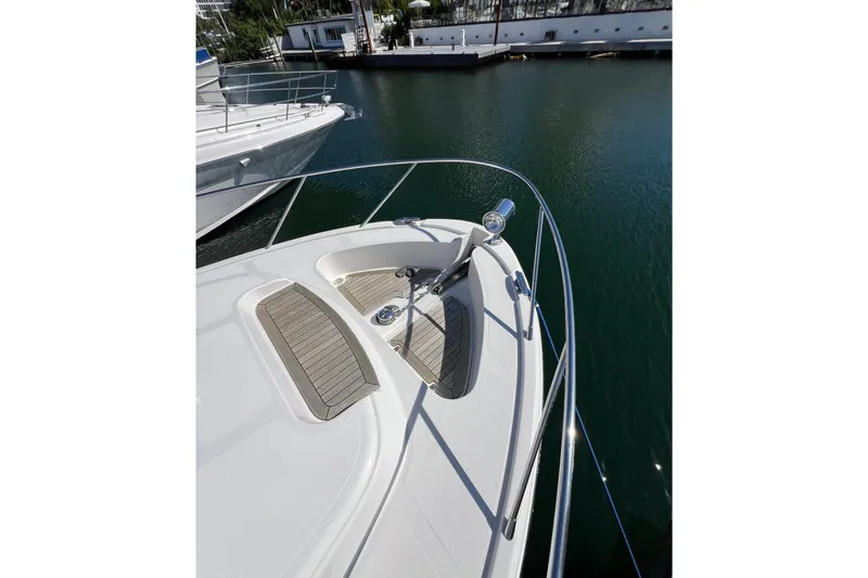 Slide: The Image of 2007 Chris-Craft Roamer 40 yacht with wooden trim, docked at marina. - 20