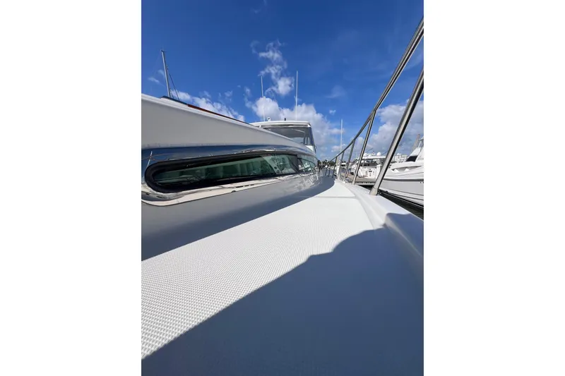 Slide: The Image of Storage compartment of a 2007 Chris-Craft Roamer 40 boat, featuring hoses and equipment. - 22