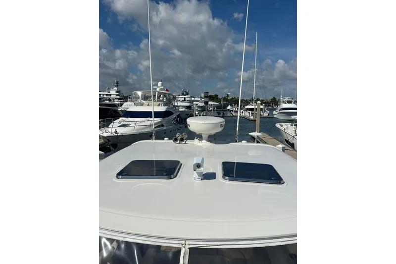 Slide: The Image of 2007 Chris-Craft Roamer 40 yacht docked at marina, showcasing sleek deck design. - 26