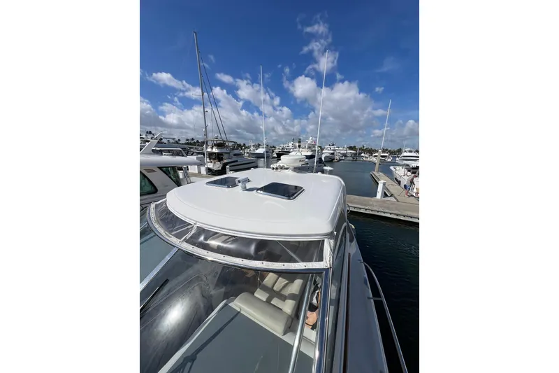 Slide: The Image of 2007 Chris-Craft Roamer 40 yacht roof with hatches and radar equipment at marina. - 27