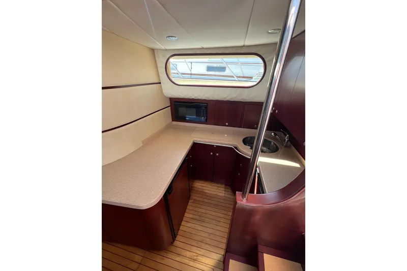 Slide: The Image of Luxurious 2007 Chris-Craft Roamer 40 yacht interior kitchen with modern amenities. - 29