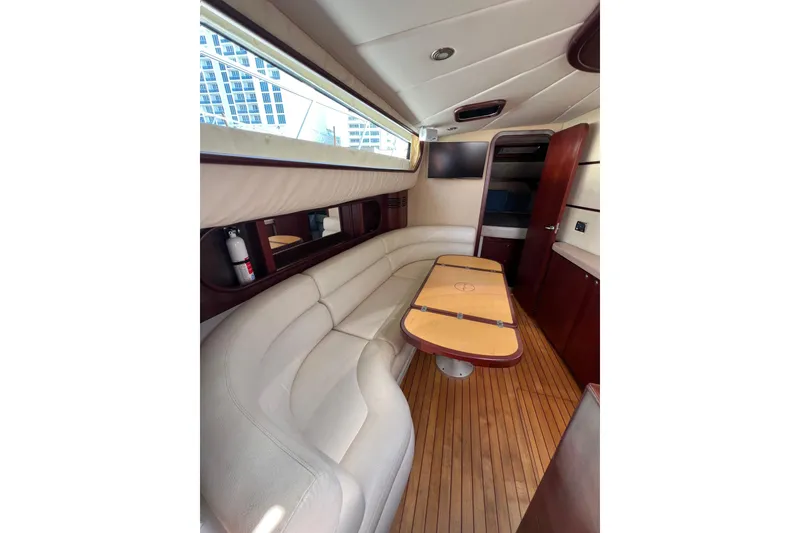 Slide: The Image of Luxurious interior of 2007 Chris-Craft Roamer 40 with elegant seating and wooden table. - 33