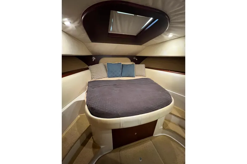 Slide: The Image of Luxurious interior of 2007 Chris-Craft Roamer 40 yacht with elegant seating and wooden table. - 34