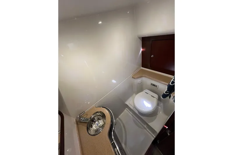 Slide: The Image of Storage area inside 2007 Chris-Craft Roamer 40, featuring organized boxes and containers. - 39