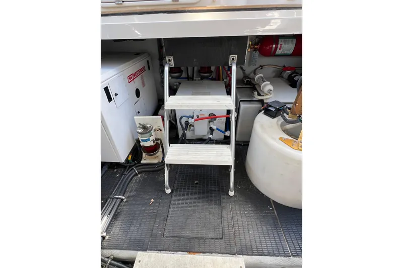 Slide: The Image of Engine compartment of a 2007 Chris-Craft Roamer 40 with visible components and wiring. - 45