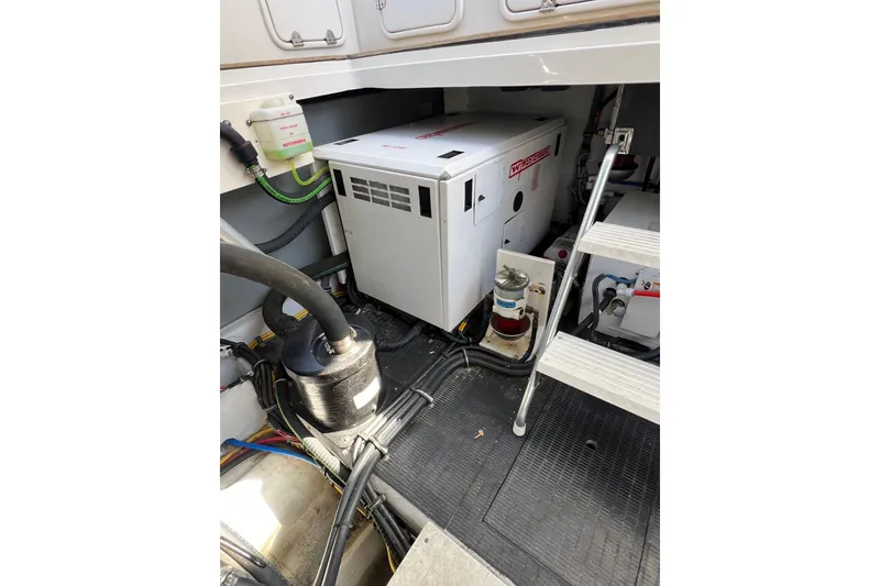 Slide: The Image of Engine compartment of 2007 Chris-Craft Roamer 40 with visible Volvo Penta components. - 46