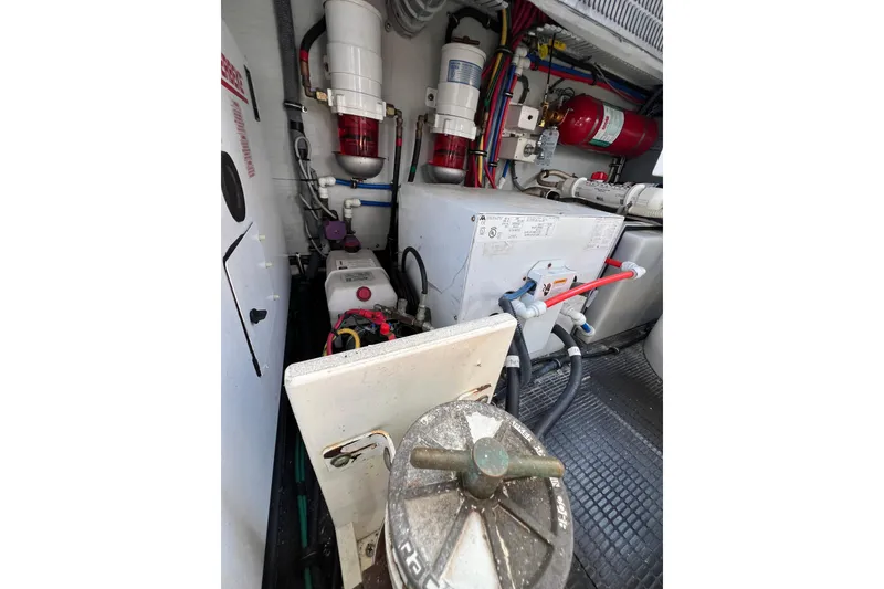 Slide: The Image of Engine compartment of a 2007 Chris-Craft Roamer 40 boat, showcasing mechanical components. - 48