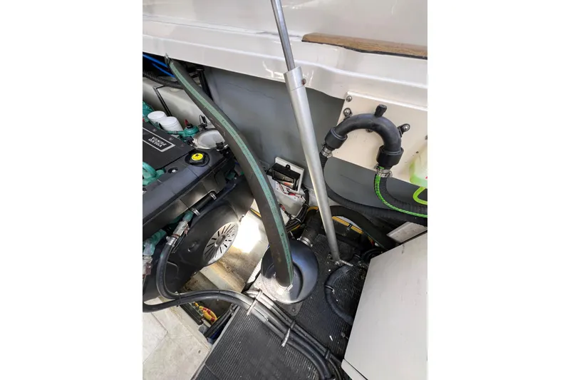 Slide: The Image of Engine room of 2007 Chris-Craft Roamer 40 with equipment and ladder access. - 49