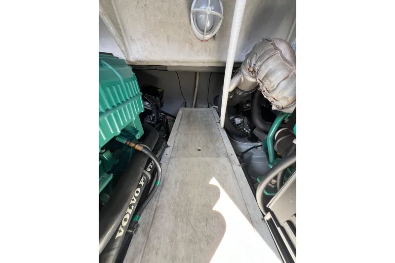 Slide: The Image of Engine room of 2007 Chris-Craft Roamer 40 with mechanical components and wiring. - 52