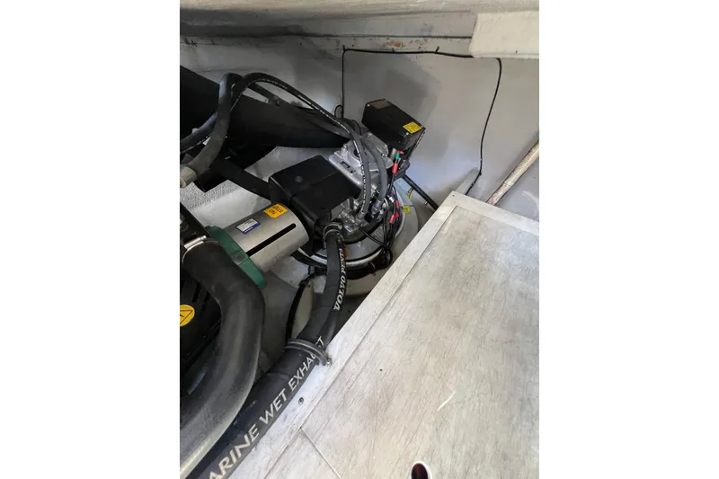 Slide: The Image of Engine compartment of 2007 Chris-Craft Roamer 40 with Westerbeke generator. - 53