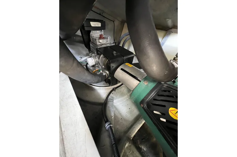 Slide: The Image of Engine compartment of 2007 Chris-Craft Roamer 40 with Westerbeke generator and coolant system. - 54