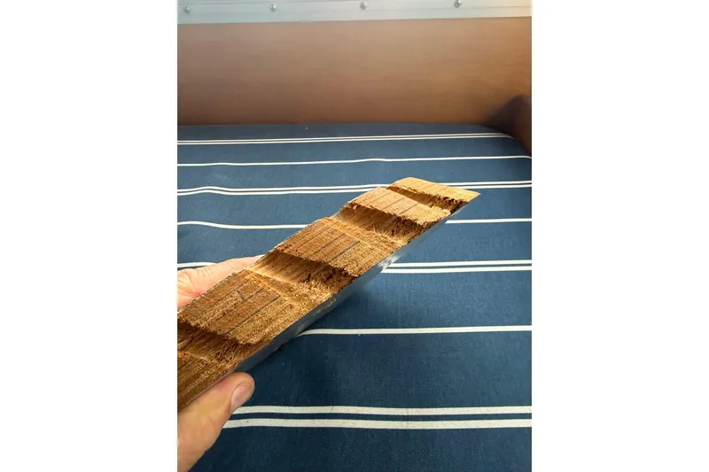 Slide: The Image of Close-up of a hand holding a wooden piece, Devlin 38, 1996 model. - 22