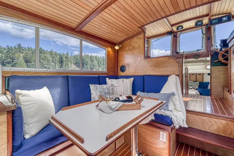 Slide: The Image of Interior of 1996 Devlin 38 boat with cozy seating and wooden finishes. - 5