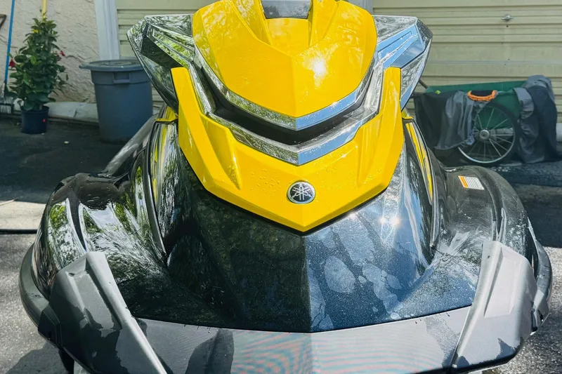 Slide: The Image of 2015 Yamaha WaveRunner VXR in vibrant yellow and black, parked outdoors. - 1