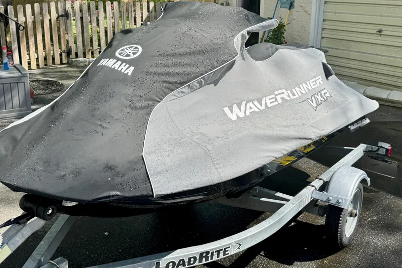 Slide: The Image of 2015 Yamaha WaveRunner VXR covered on trailer, parked outdoors. - 4