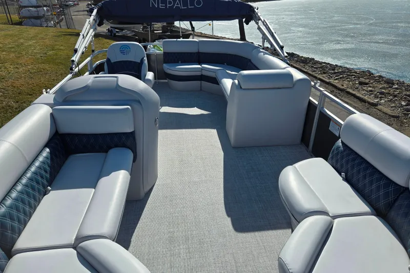 Slide: The Image of 2024 Nepallo 18TL pontoon boat interior with luxurious seating and waterfront view. - 11