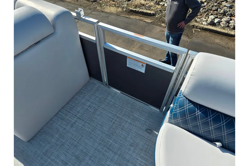 Slide: The Image of 2024 Nepallo 18TL boat interior with gray seating and blue plaid cushion. - 12