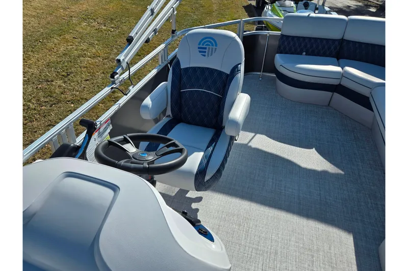 Slide: The Image of 2024 Nepallo 18TL boat interior with steering wheel and cushioned seating. - 13