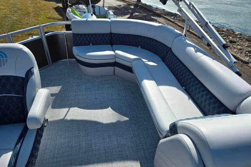 Slide: The Image of 2024 Nepallo 18TL pontoon boat with luxurious seating and waterfront view. - 14