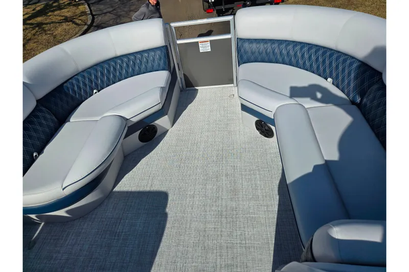 Slide: The Image of 2024 Nepallo 18TL pontoon boat interior with blue and gray seating, carpeted floor. - 20