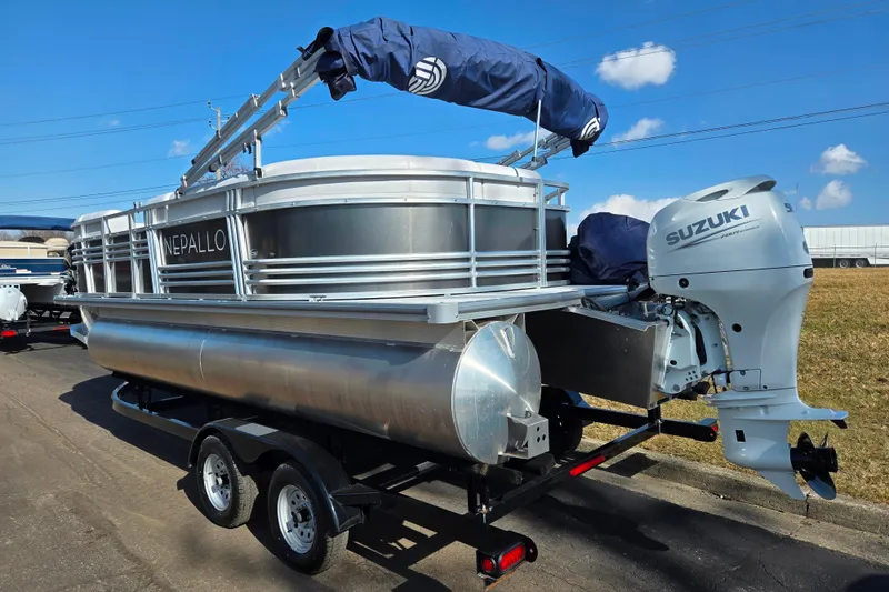 Slide: The Image of 2024 Nepallo 18TL pontoon boat with Suzuki outboard motor on trailer. - 3