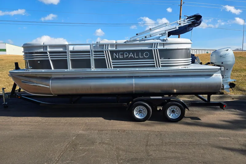 Slide: The Image of 2024 Nepallo 18TL pontoon boat on trailer under blue sky. - 4