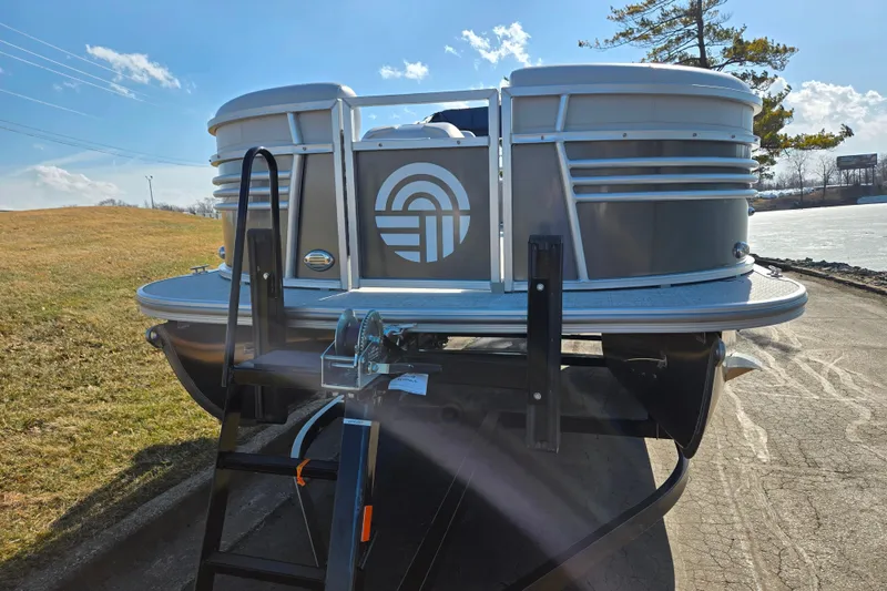 Slide: The Image of 2024 Nepallo 18TL pontoon boat on trailer, sunny outdoor setting. - 6