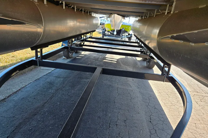 Slide: The Image of Underneath view of a 2024 Nepallo 18TL boat trailer on pavement. - 7