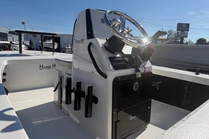 Slide: The Image of 2016 Maverick Mirage 18 HPX-V boat interior with steering console and rod holders. - 10