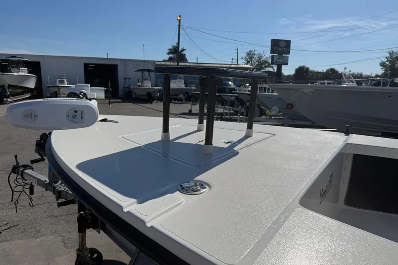 Slide: The Image of 2016 Maverick Mirage 18 HPX-V boat deck with equipment in a marina setting. - 4